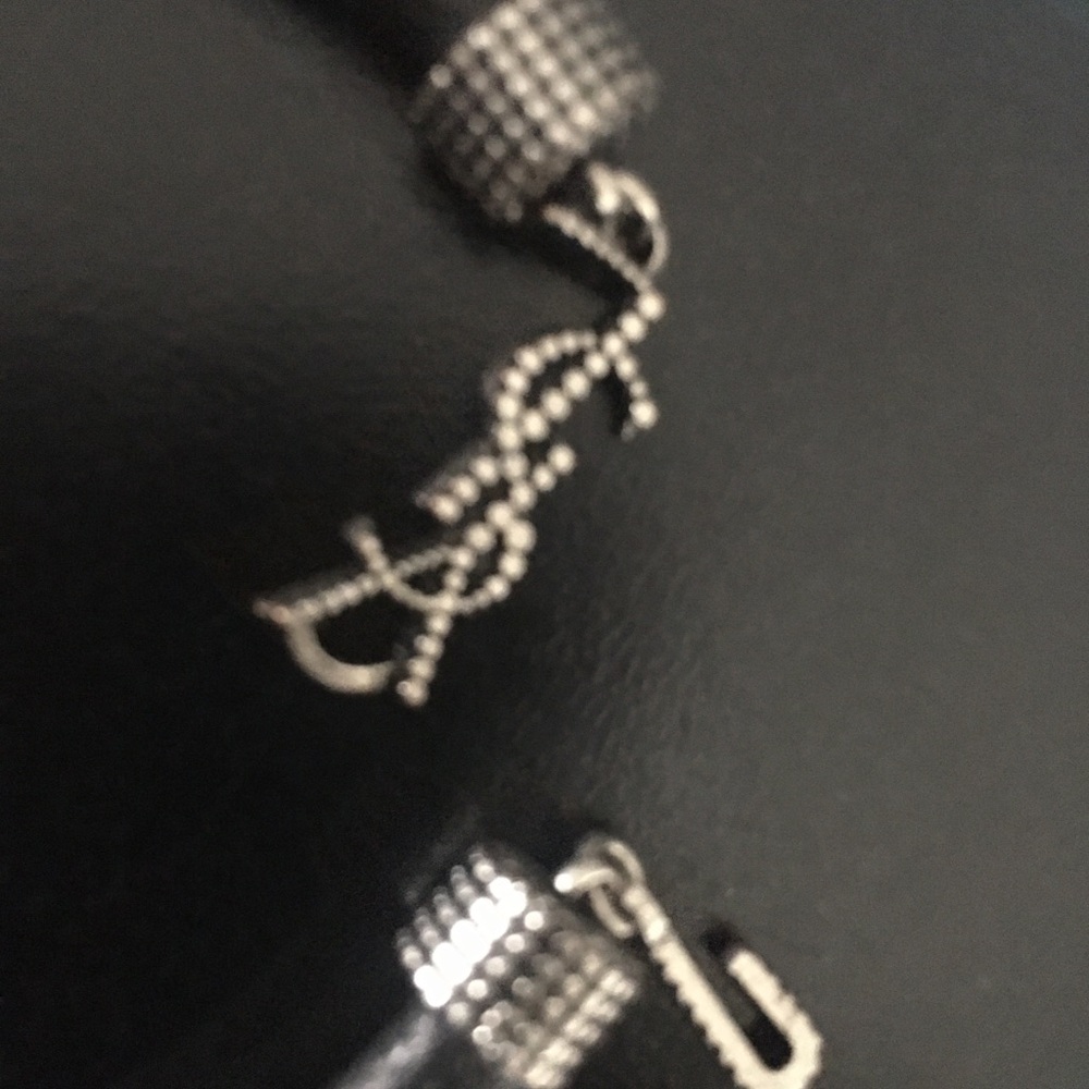 YSL Minimalist lamb and stainless logo studs Bracelet new display no box.